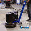 A man using an On Floor Technologies' Onfloor Planetary Surfacing Machine on a concrete floor.