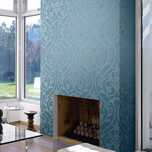 A fireplace with a blue and silver patterned wallpaper from Wallquest's Fiona Collection.