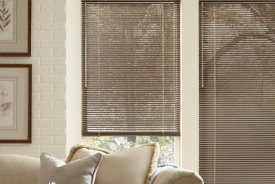 A living room with Modern Precious Metals window blinds by Hunter Douglas, available at Gleco Paint in PA.
